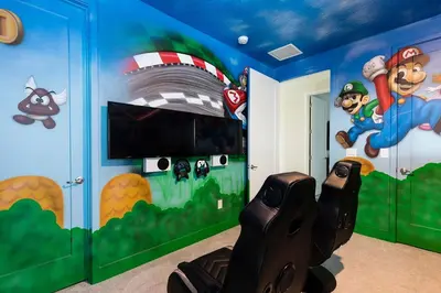 a bedroom with a disney themed room with a cartoon mural at The Nicklaus View Haven-TB007 in Orlando