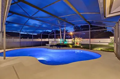 an overhead view of a swimming pool under a roof at Beautiful Indian Ridge Home - Close to Disney in Orlando
