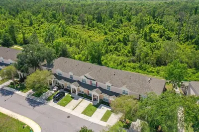 an aerial view of a large house with trees at Celtic Palms: Private Pool & Near Disney Magic in Kissimmee