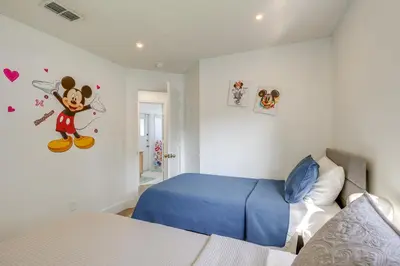a bedroom with a mickey mouse sticker on the wall at 6 Mi to Disney World Home with Large Yard! in Orlando