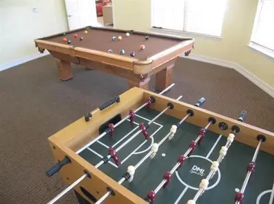 a pool table with balls on it in a room at Cane Island Resort 2BR Condo, Close to Attractions in Kissimmee