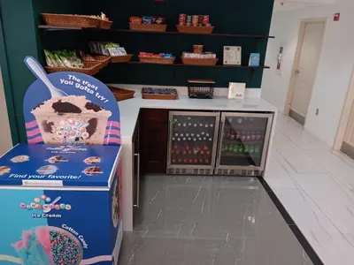 a candy store with a counter with a display at Montreal Suites Orlando in Orlando