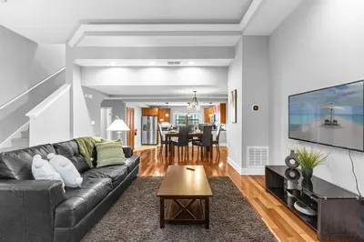 a living room with a couch and a table at Summer Fun Starts Here - Townhome by Disney! in Orlando