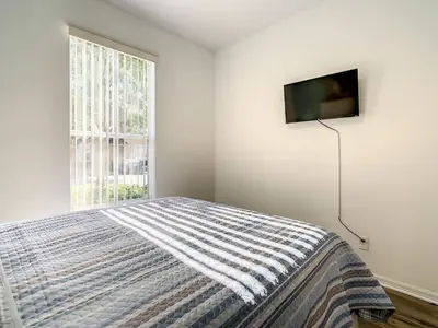 a bedroom with a bed and a window at Old Town and Food trucks around the corner in Orlando