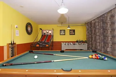 a billiard room with a pool table and a slide at Family Villa Near Disney with Private Pool in Kissimmee