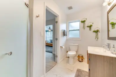 a bathroom with a toilet and a sink at Nature-Packed Family Escape Near Lake Tohopekaliga in Kissimmee