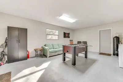 a living room with a couch and a table at Nature-Packed Family Escape Near Lake Tohopekaliga in Kissimmee