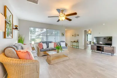 a living room with a couch and a ceiling fan at Nature-Packed Family Escape Near Lake Tohopekaliga in Kissimmee