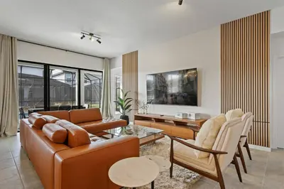 a living room with a couch and a table at Paradiso Grande Resort 9Bedroom Vacation Home 6210 in Orlando