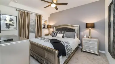 a bedroom with a bed and a ceiling fan at CTD4741-102 in Kissimmee