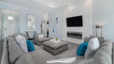 a living room with a couch and a fireplace at CTD4751-401 in Kissimmee