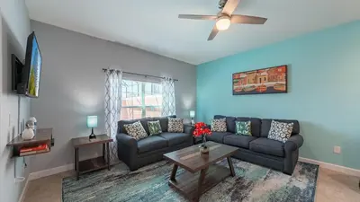 a living room with a couch and a table at CUP8946 in Kissimmee