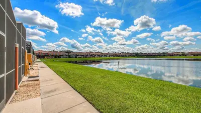 a walkway next to a body of water at CUP8946 in Kissimmee
