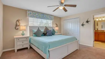 a bedroom with a bed and a ceiling fan at CUP8968 in Kissimmee
