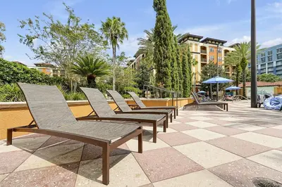 a row of chairs sitting on a patio at 12538 INTERNATIONAL DRIVE #C303 ORLANDO 2BED in Orlando