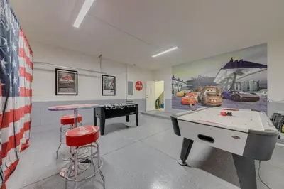 a room with a ping pong table and a ping pong table at 5 Bedroom private pool home in Veranda Palms in Kissimmee