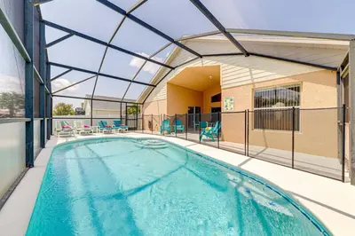 a swimming pool in a building with a glass ceiling at Pool home close to Golfing and Theme parks in Orlando