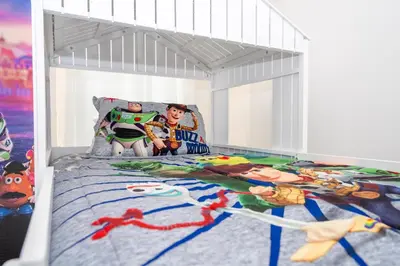 a bedroom with a captain america bed with toys on it at 5761 HS - Spacious Luxury Villa in Paradiso Grande in Orlando