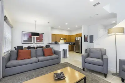 a living room with a couch and two chairs at Regal Oaks Retreat: Pool, Hot Tub & Near Disney in Kissimmee