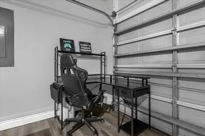 a room with a desk and a chair in a room at Spacious 7-Bedroom Home at Bella Vida Resort with Conservation View in Kissimmee