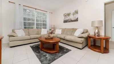 a living room with a couch and a table at ALM2774-204 in Orlando