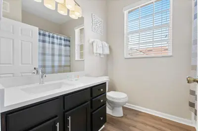 a bathroom with a sink and a toilet at ALM2774-403 in Orlando