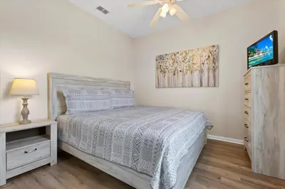 a bedroom with a bed and a ceiling fan at ALM2774-403 in Orlando