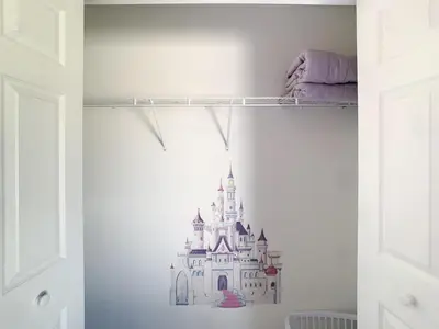 a bedroom with a disney castle sticker on a wall at Relax Away Villa: Private Pool Home Near Disney in Orlando