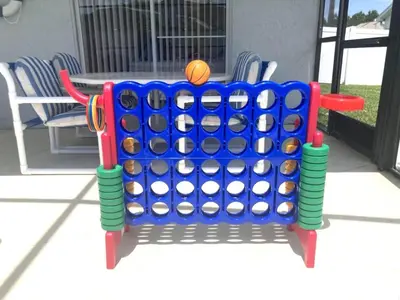 a large blue and green giant game with a basketball at Relax Away Villa: Private Pool Home Near Disney in Orlando