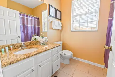 a bathroom with a sink and a toilet at ALM2813-403 in Orlando