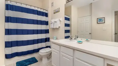 a bathroom with a sink and a toilet and a shower at ALM2821-104 in Orlando