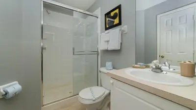 a bathroom with a shower and a sink and a toilet at FP8208 Windsor Palms Resort Vacation Home in Kissimmee