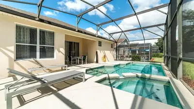 a swimming pool in a house with a glass ceiling at FP8208 Windsor Palms Resort Vacation Home in Kissimmee