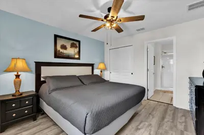 a bedroom with a bed and a ceiling fan at GRS7756 in Orlando