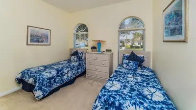 a bedroom with two beds and two windows at FP8147 Windsor Palms Resort Vacation Home in Kissimmee