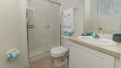 a bathroom with a sink and a toilet and a shower at FP8150 Windsor Palms Resort Vacation Home in Kissimmee
