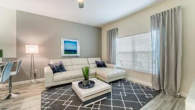 a living room with a couch and a table at PEQ3141 in Kissimmee