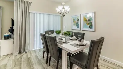 a dining room with a table and chairs at PEQ3141 in Kissimmee