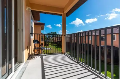 a balcony with a view of a building at Spacious Regal Oaks Retreat - Steps to the Pool in Orlando