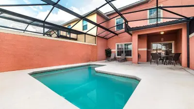 a swimming pool in a house with a patio at BCH3031 in Kissimmee