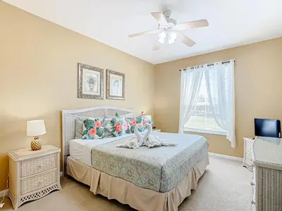a bedroom with a bed and a ceiling fan at Spacious Windsor Palms Retreat - 11 Min to Disney in Kissimmee