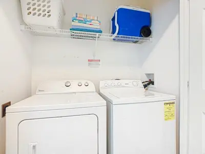 a laundry room with a washer and dryer at Spacious Windsor Palms Retreat - 11 Min to Disney in Kissimmee