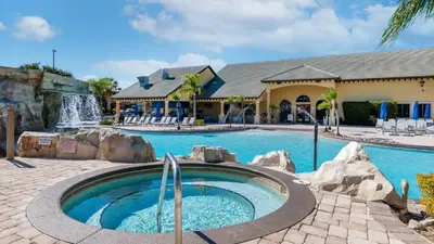 a swimming pool with a waterfall in a resort at BCH3043 in Kissimmee