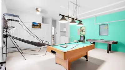 a room with a ping pong table and a net at CW7705 Windsor Hills Resort Vacation Private Pool Home in Orlando