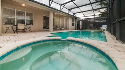 a large swimming pool in the middle of a house at CW7705 Windsor Hills Resort Vacation Private Pool Home in Orlando