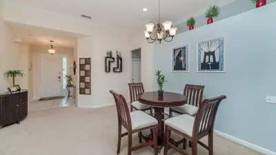 a dining room with a table and chairs at CW7705 Windsor Hills Resort Vacation Private Pool Home in Orlando