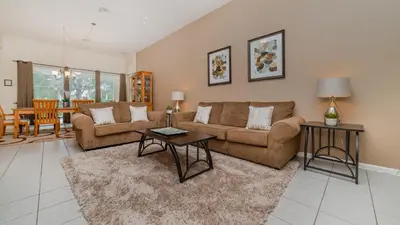 a living room with a couch and a table at CW7719 Windsor Hills Resort Vacation Home in Orlando