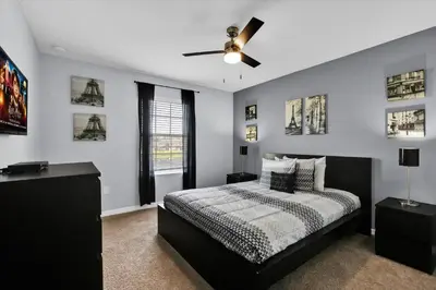 a bedroom with a bed and a ceiling fan at BCH3069 in Kissimmee