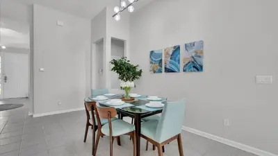 a dining room with a table and chairs at CW7739 Windsor Hills Resort Vacation Home in Orlando