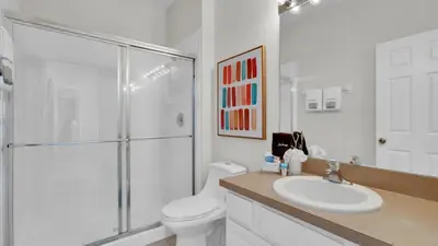 a bathroom with a shower and a toilet and a sink at CW7739 Windsor Hills Resort Vacation Home in Orlando